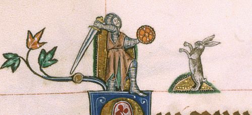 A knight swings his sword at a rabbit which rears up on its hind legs