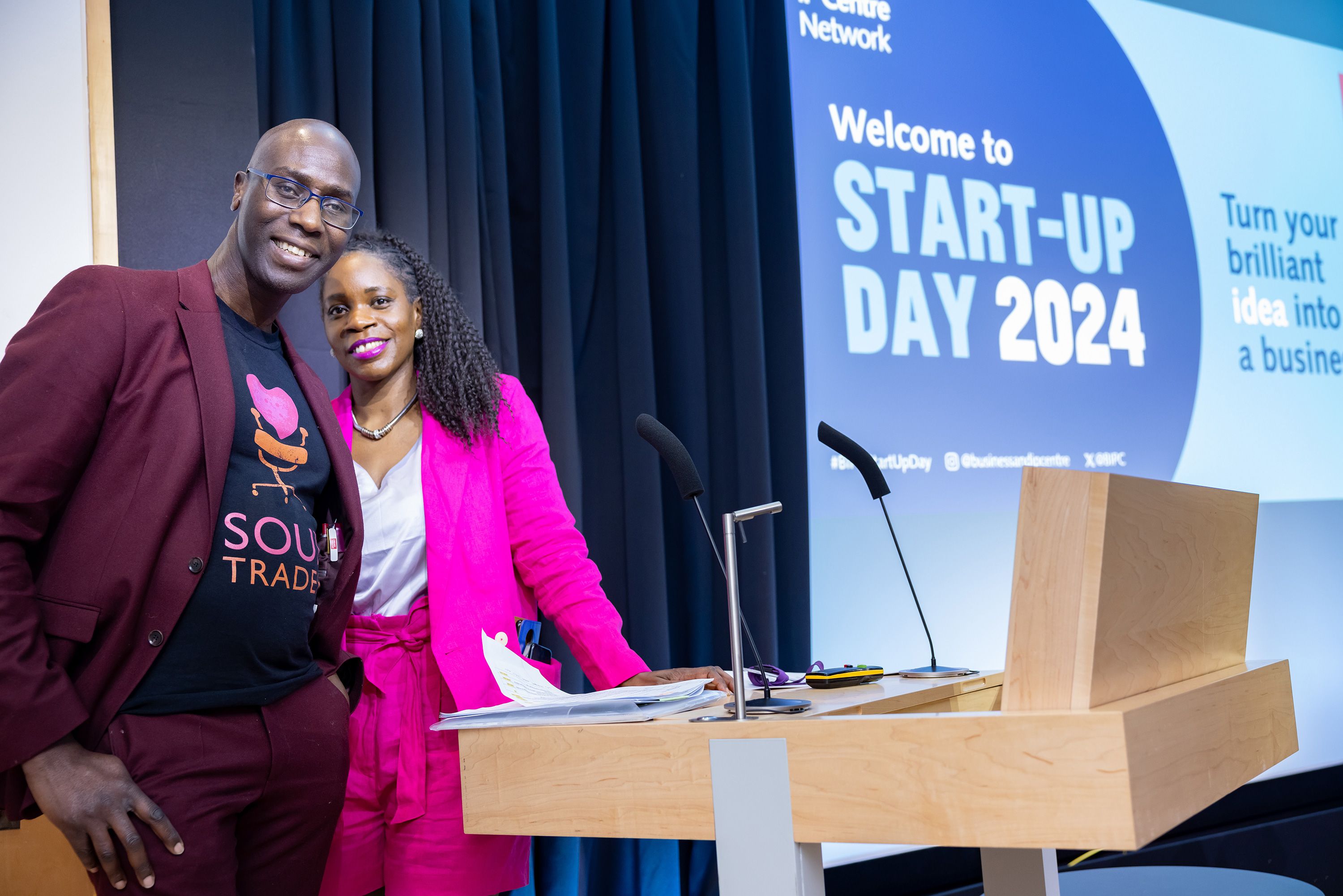 Speakers at lectern.