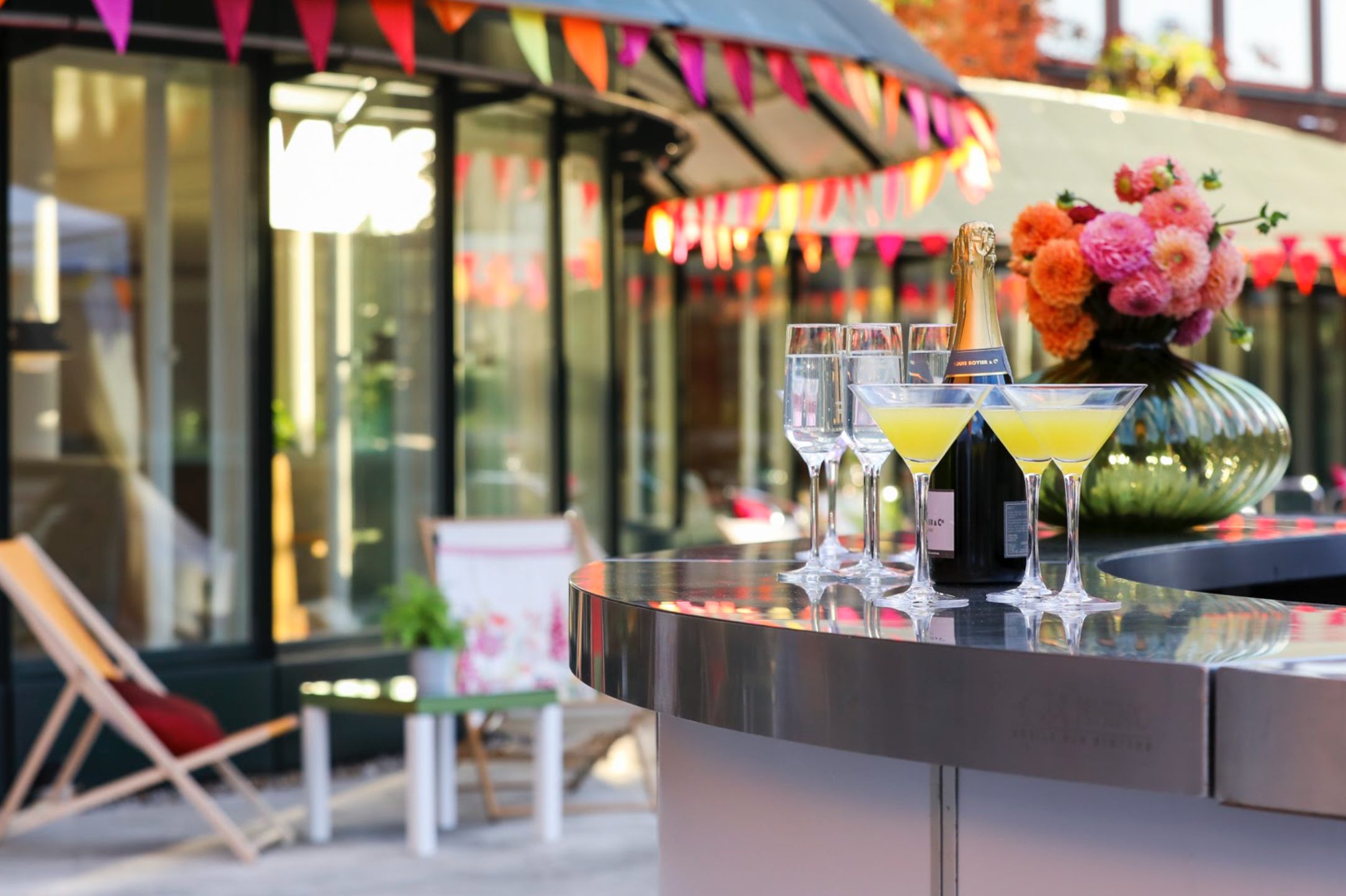 British Library Terrace outdoor space with a close up of champagne and glasses.