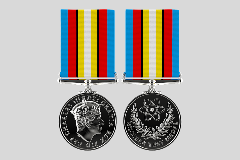The back and front of the Nuclear Test Medal. The front of the medal features an illustration of an atom. The white and yellow of the medal ribbon signifiy the light and burning of the detonation, while the blue signifies the sky and ocean.