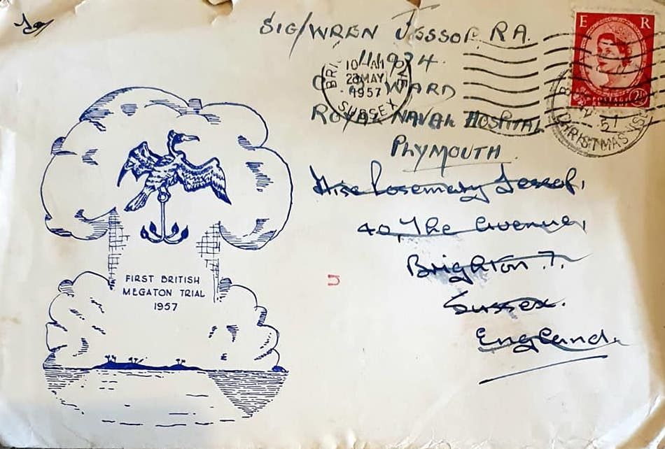 A white envelope with a red stamp. The envelope is marked with an outline of a mushroom cloud and frigate bird, the official sign of Operation Grapple.
