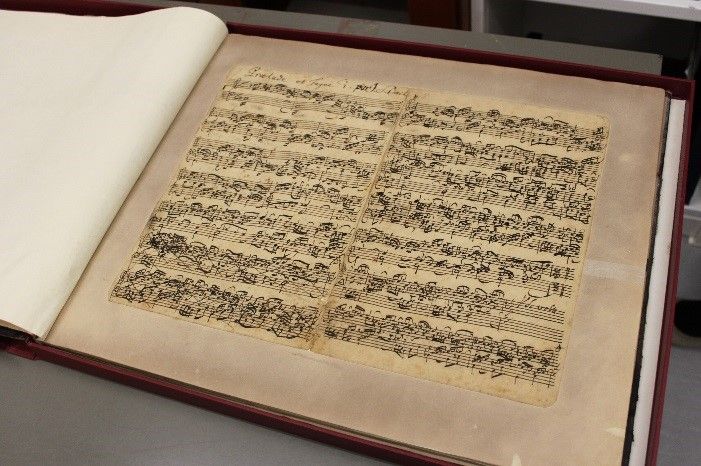 Bach manuscript in the old paper mounts.