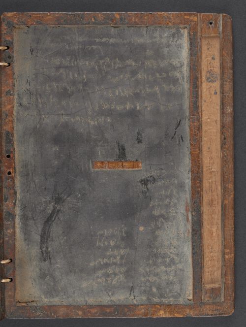 The last part of a set of bound wax tablets with a groove to store the stylus