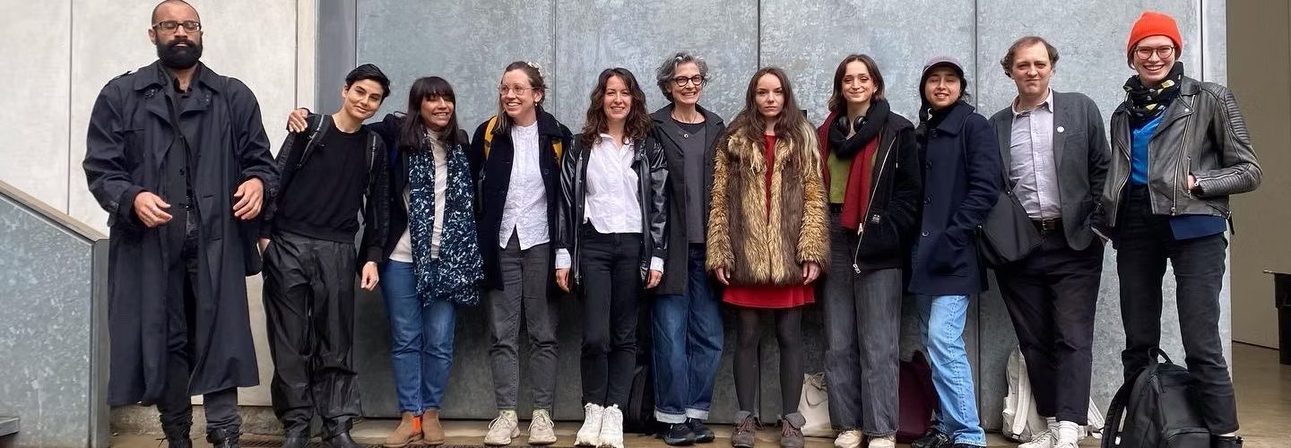 Ella Snell and a row of 11 artists.