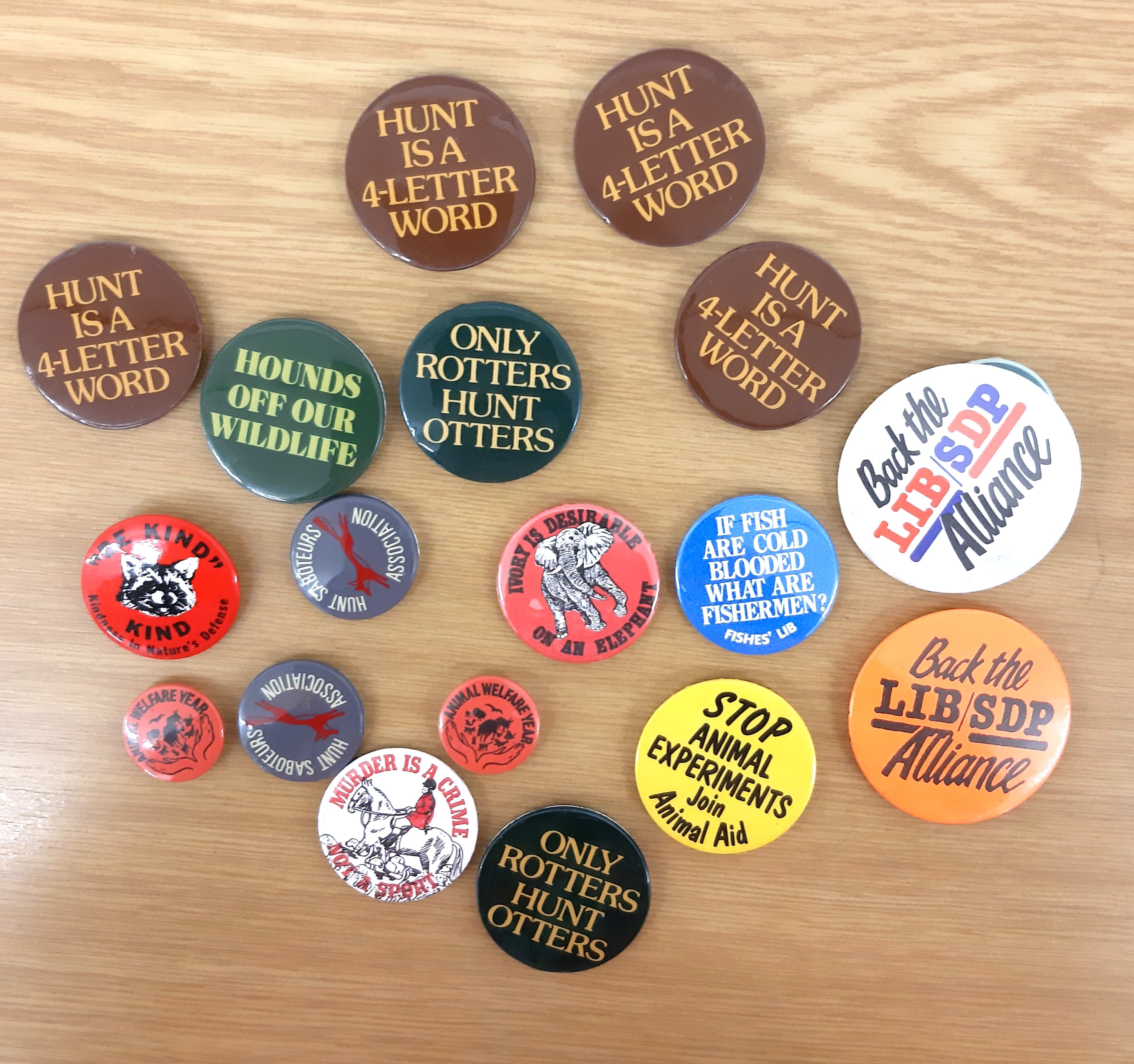 An assortment of badges relating to animal rights.
