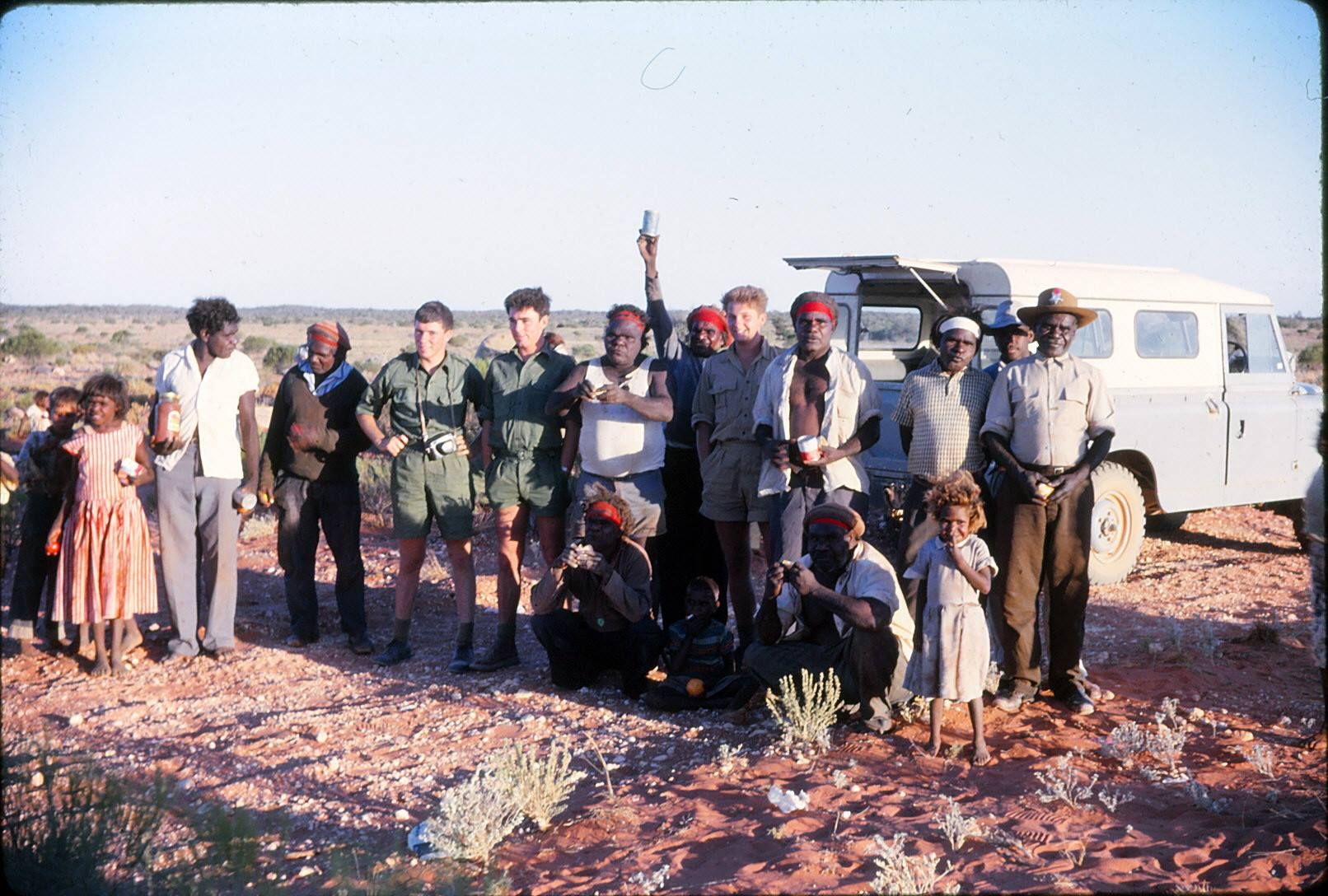 British airmen in khaki and Indigenous people near Maralinga.