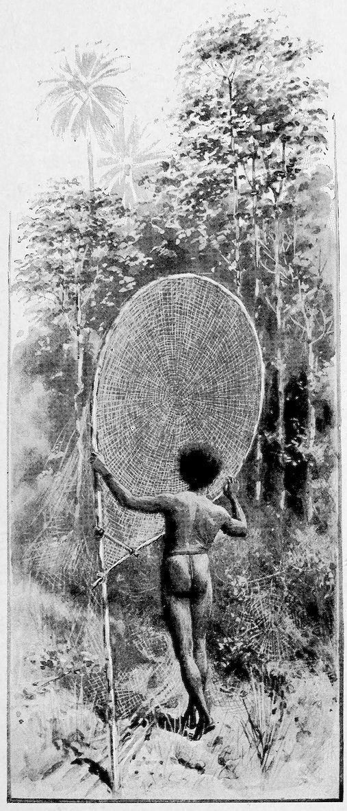 Man holding up a spiderweb fishing net.