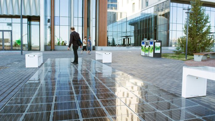 Man walking on patio solar paving.
