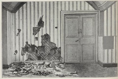 Photograph of the basement of the Ipatiev house after the murders, with broken plaster on the floor.