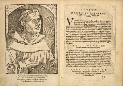 An opening from a printed copy of a pamphlet by Martin Luther, featuring the beginning of the text of the treatise and a portrait of Luther in a monk’s habit.