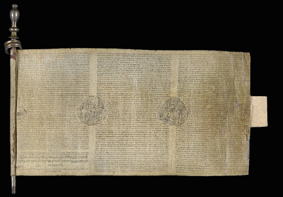 Minute Esther Scroll (50 x 94 mm) written on a single strip of vellum wound on a silver-plated roller.