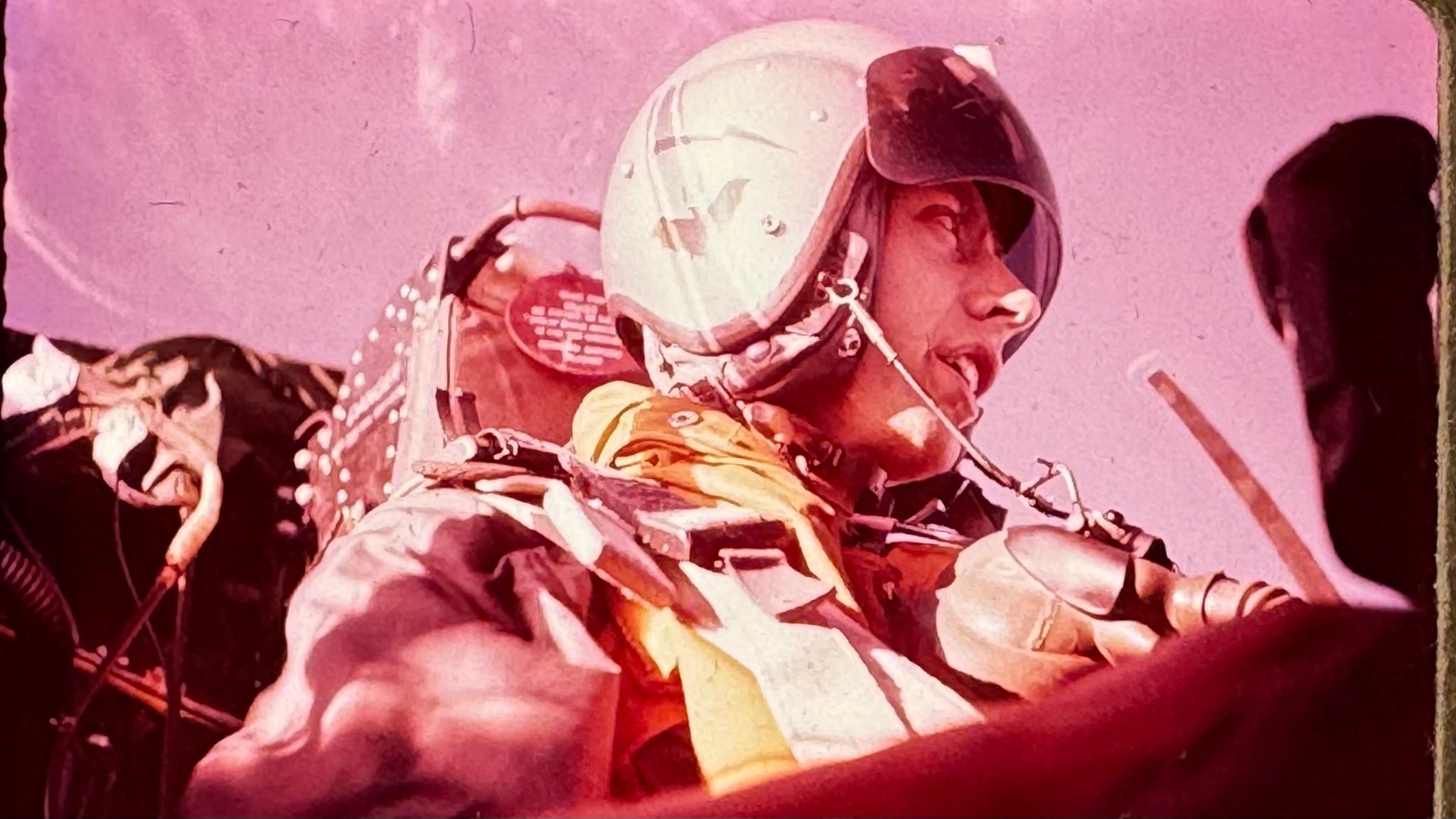 Terry Hilliard in the cockpit, wearing a headset.