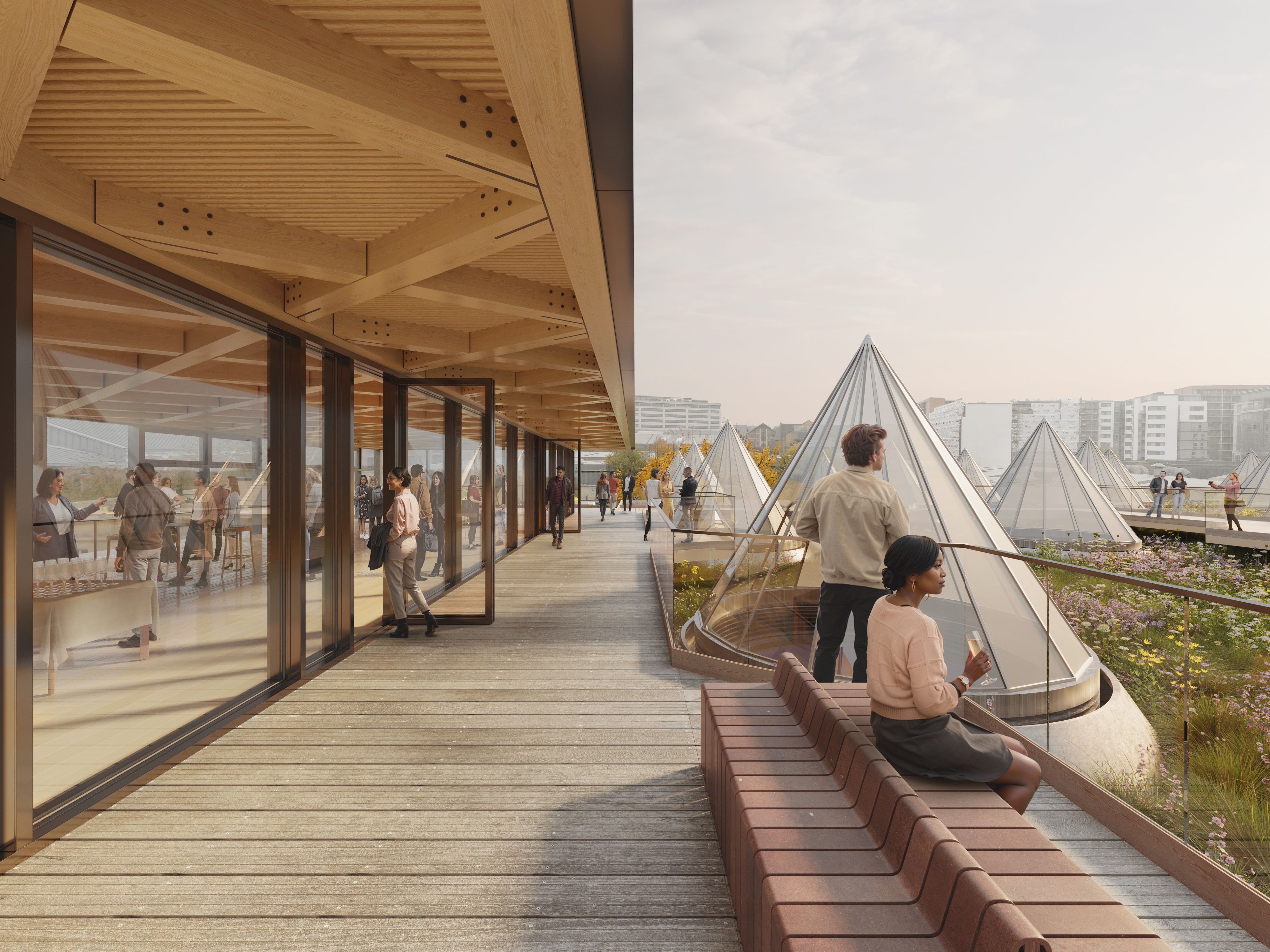 An artist impression of people enjoying a large terrace overlooking conical skylights and a wildflower roof.