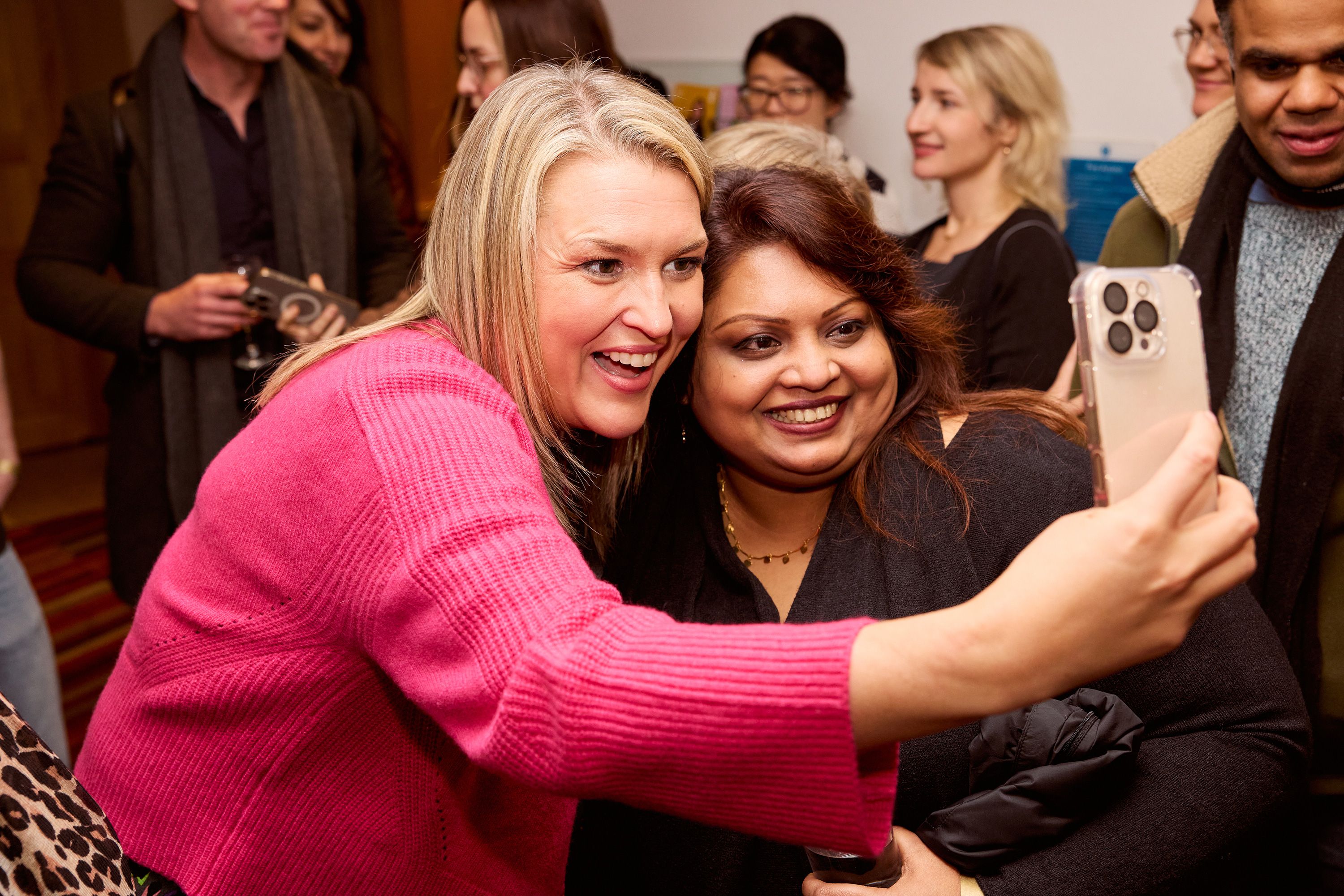 Sara Davies taking selfie with event attendee.