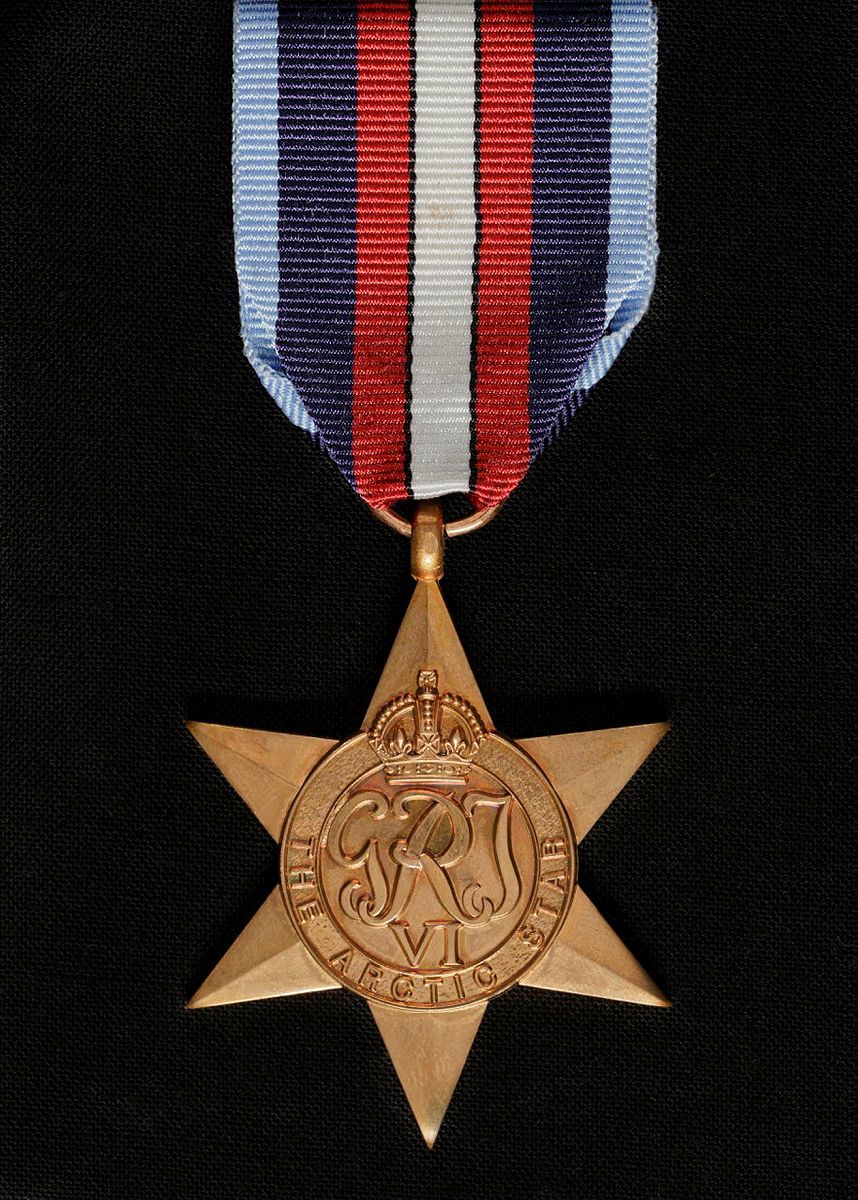 A gold medal in the shape of a star.