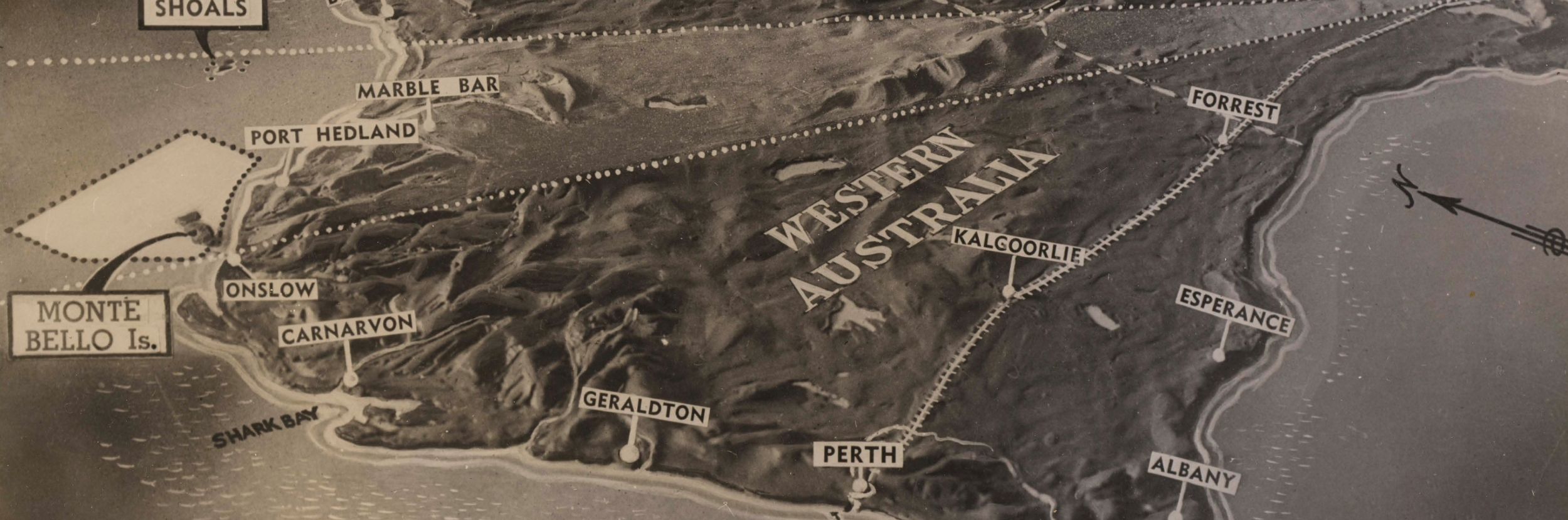 A curving map of the Australian continent, focusing on the space between Woomera in South Australia and the Monte Bello Islands in Western Australia.