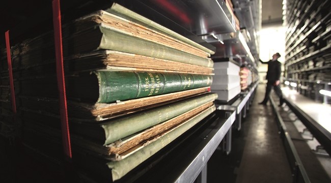 Shelves at the British Library, holding newspapers and other items